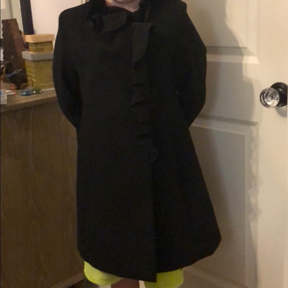 Black coat with ruffled collar down the front